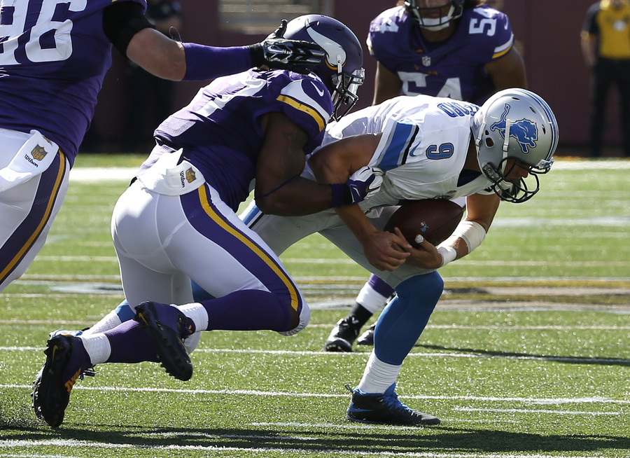 Detroit Lions quarterback Matthew Stafford is sacked by Minnesota Vikings defensive end Everson Griffen in the second half of an NFL football game in Minneapolis Sunday Sept. 20 2015