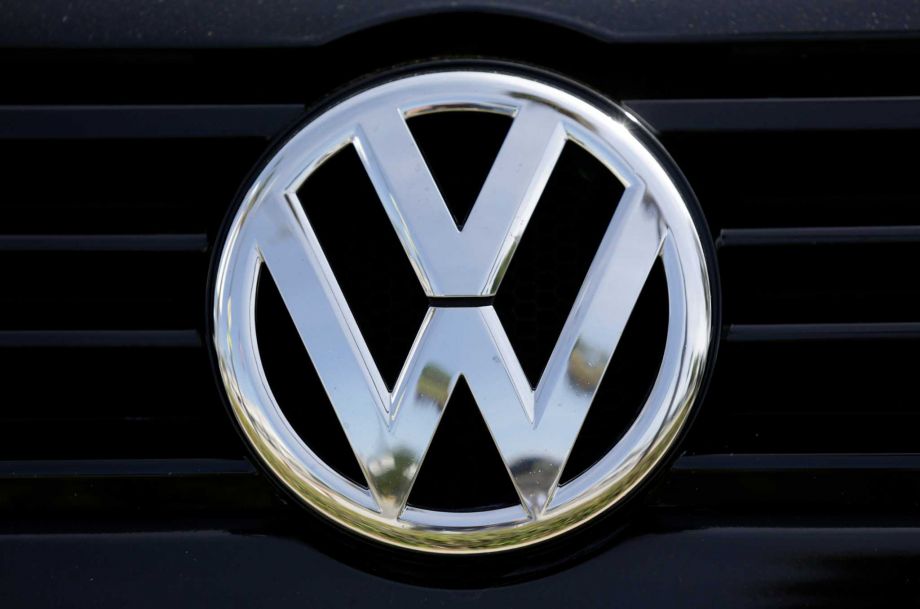 The Volkswagen logo is seen on car offered for sale at New Century Volkswagen dealership in Glendale Calif. Monday Sept. 21 2015. Volkswagen shares plunged Monday after U.S. regulators accused the German automaker of cheating on emissions tests alleg