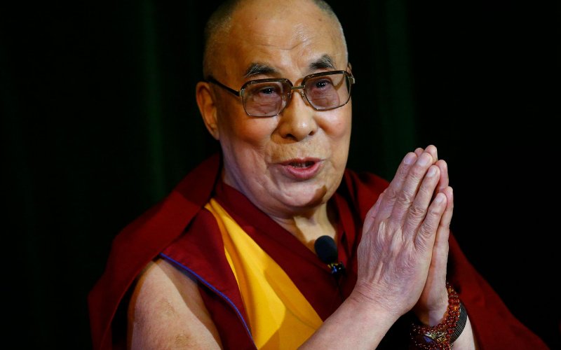 Tibetan spiritual leader the Dalai Lama speaks during a news conference at Magdalene College in Oxford Britain