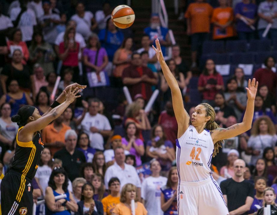 Tulsa Shock's Odyssey Sims shoots over the defense of Phoenix Mercury's Brittney Griner during the opening game of a WNBA basketball Western Conference semifinal series Thursday Sept. 17 2015 in Phoenix