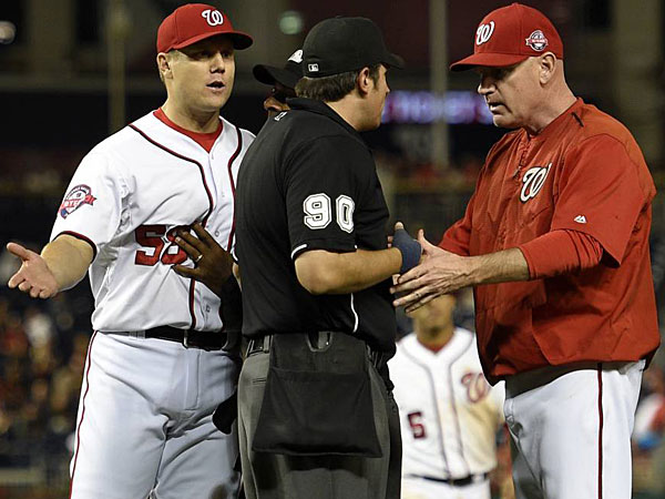 Jonathan Papelbon and manager Matt Williams talk to the umpire