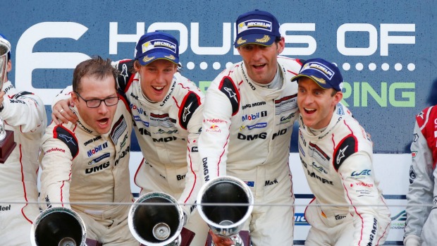 Porsche team principal Andreas Seidl Brendon Hartley Mark Webber and Timo Bernhard after winning for Porsche in the world endurance championship event at Nurburgring