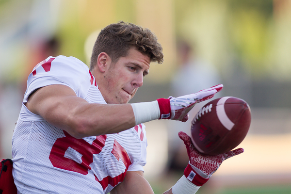 Wide receiver Brandon Reilly makes a catch during fall camp