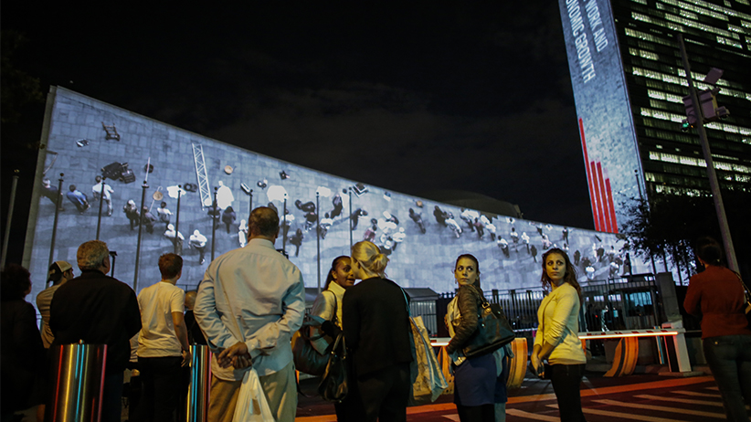 NEW YORK NY- SEPTEMBER Watching large-scale development goal projections at the general assembly building at United Nations headquarters in New York City. Kena Betancur  Getty Images for Global Goals