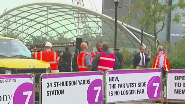 Workers gather before the grand opening of the No. 7 subway extension at Hudson Yards on Sept. 13 2015