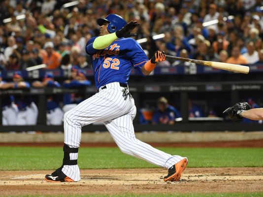 New York Mets left fielder Yoenis Cespedes swings