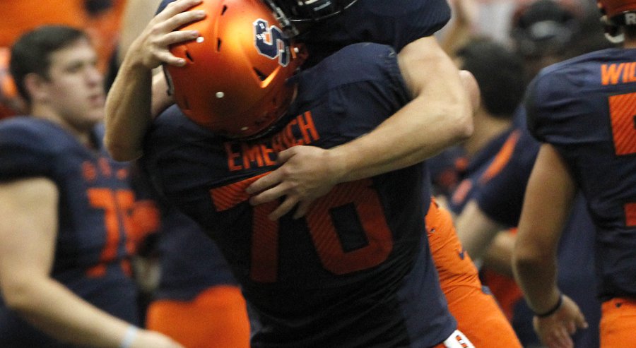 Syracuse’s Zack Mahoney top and Jason Emerich bottom celebrate after defeating Central Michigan in an NCAA college football game in Syracuse N.Y. Saturday Sept. 19 2015. Syracuse won 30-27