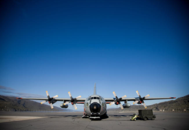 A US Air National Guard C-130 Airplane sitting on the tarmac