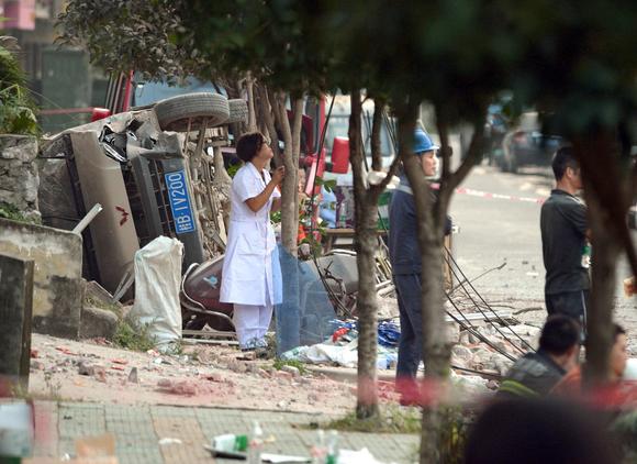 A vehicle lies on its side after Thursday's attack in Liuzhou.																						
		
		
																			
				Close