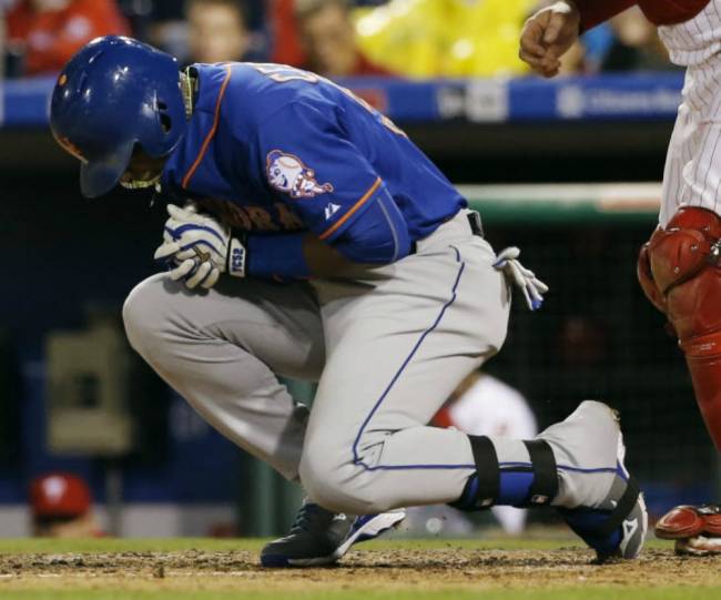 Mets&#39 Yoenis Cespedes reacts after being hit by a pitch from Philadelphia Phillies&#39 Justin De Fratus