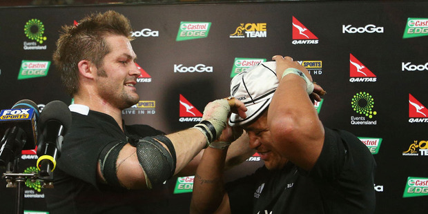 All Blacks skipper Richie Mc Caw gives Keven Mealamu his 100th test cap