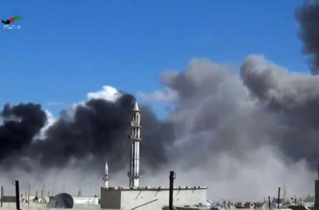 An image from the Homs Media Centre shows smoke billowing from buildings in Homs