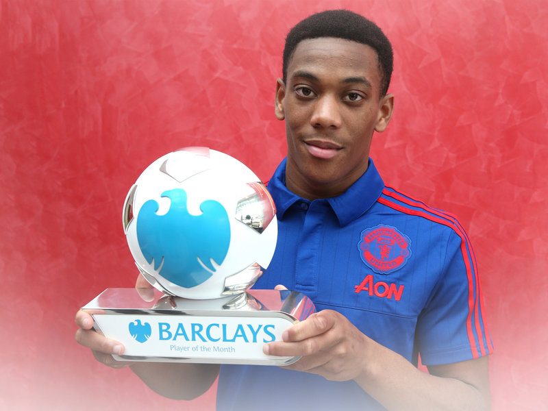 Anthony Martial poses with his Barclays Player of the Month award