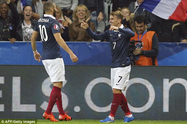 Antoine Griezmann celebrates with team-mate Karim Benzema after giving France the lead