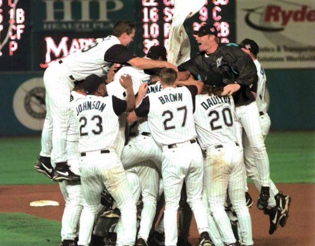 The Florida Marlins celebrate their 3-2 eleventh-inning victory over the Cleveland Indians in game seven of the 1997 World Series at Pro Player Stadium in Miami