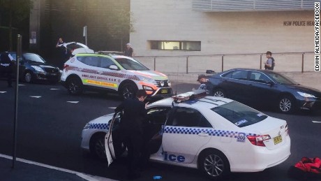 Authorities respond after a shooting outside a police headquarters near Sydney Australia