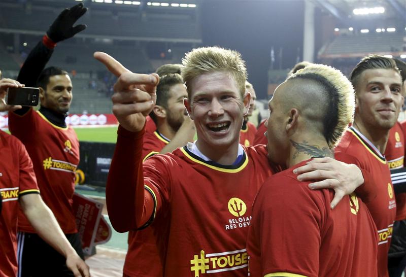 Belgium's Kevin De Bruyne celebrates with Radja Nainggolan after winning against Israel during their Euro 2016 qualifying match