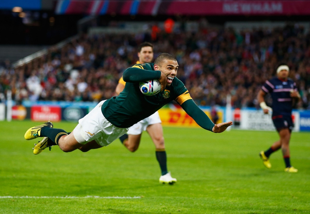 Bryan Habana dives over for the second of his three tries for South Africa against the USA