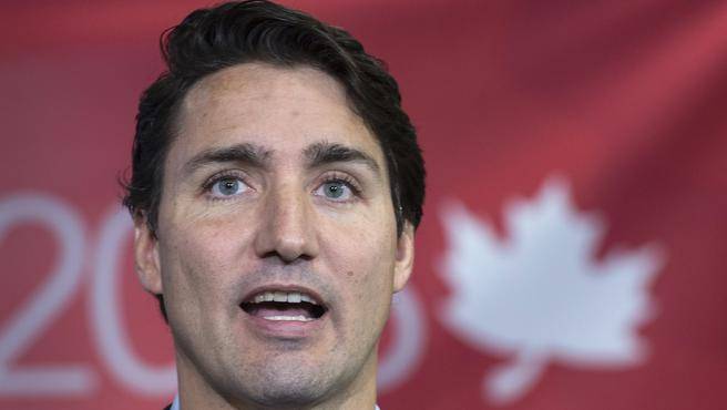 Liberal Leader Justin Trudeau addresses employees and supporters during a campaign stop at a forklift dealership in Montreal Thursday