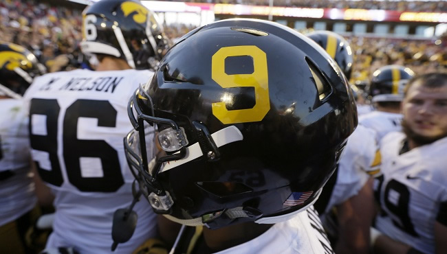 The Iowa Hawkeyes wore the No. 9 on the side of their helmets during their game Saturday Sept. 12 2015 against rival Iowa State to honor former Hawkeye Tyler Sash. Sash died Sept. 9 after he was found unresponsive in his Oskaloosa Iowa home. Sash