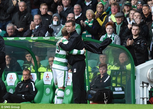 Celtic manager Ronny Deila and Kris Commons share a hug as the latter is substituted