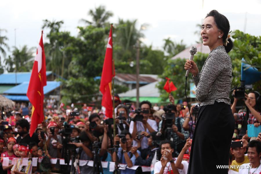 Chairperson of NLD Aung San Suu Kyi speaks during an election campaign on the outskirts of Yangon