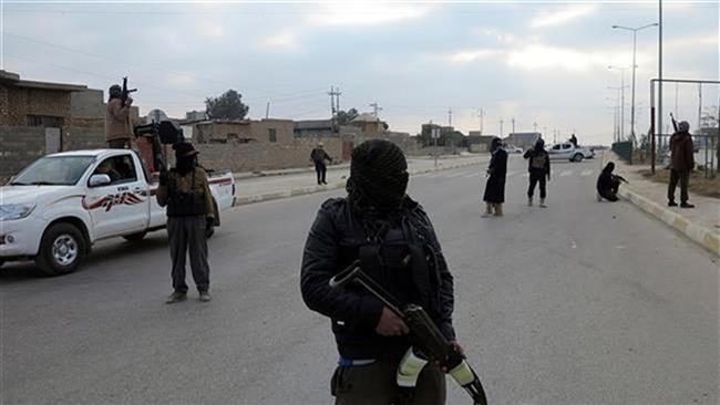 Daesh Takfiri militants are seen in an undisclosed location in Iraq