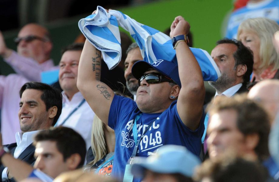 Argentine soccer great Diego Maradona cheers in the crowd ahead of the Rugby World Cup Pool C match between Argentina and Tonga at the Leicester City Stadium Leicester England Sunday Oct. 4 2015