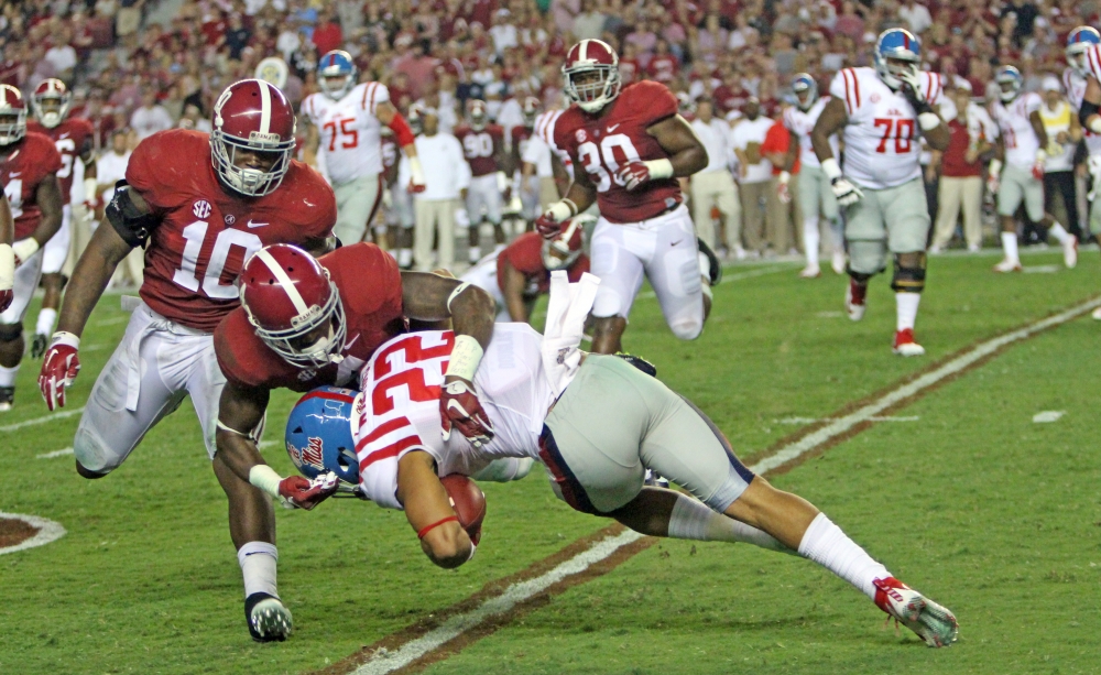 Eddie Jackson makes a tackle against Jordan Wilkins. CW | Layton Dudley