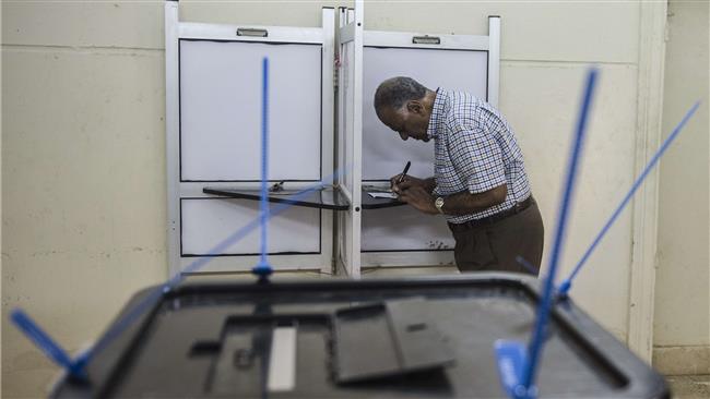 An elderly Egyptian man prepares to cast his ballot at a polling station in Cairo’s Dokki District Egypt