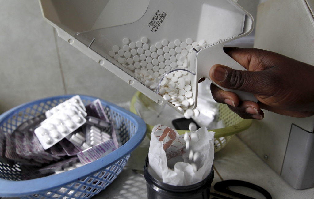 Ruth Munyao a pharmacist dispenses anti-retroviral drugs at the Mater Hospital in Kenya's capital Nairobi