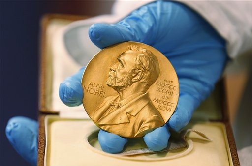 17 2015 A national libray employee shows the gold Nobel Prize medal awarded to the late novelist Gabriel Garcia Marquez in Bogota Colombia. The beginning of October 2015 means Nobel Prize time when commit