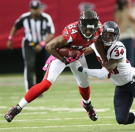 Atlanta Falcons wide receiver Roddy White makes the catch against Houston Texans cornerback A.J. Bouye during the first half of an NFL football game Sunday Oct. 4 2015 in Atlanta