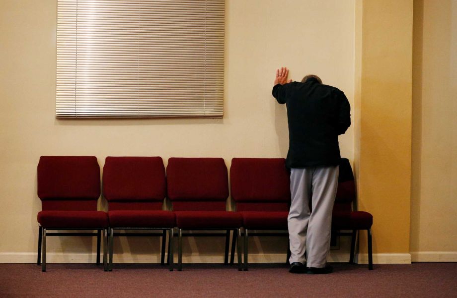 Randy Scroggins a pastor at New Beginnings Church of God cries in his church Saturday Oct. 3 2015 in Roseburg Ore. Scroggins had just spoke on the phone with the mother of a man who was shot and killed by Chris Harper Mercer while he was near his