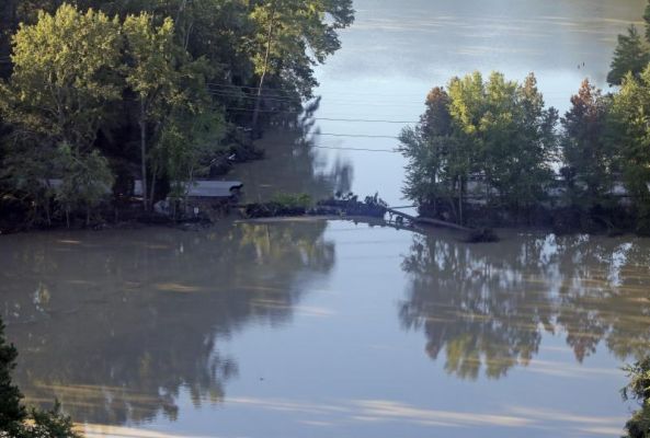 A road is washed out from flooding