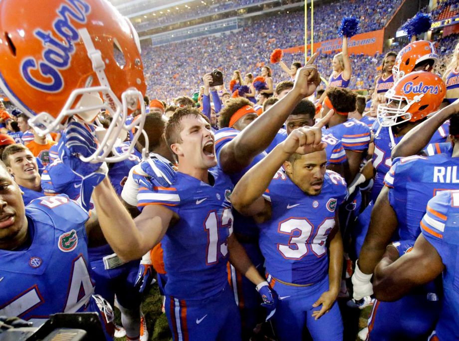 Florida players including linebacker Daniel Mc Millian and wide receiver Roger Dixon celebrate after defeating Tennessee 28-27 in an NCAA college football game Saturday Sept. 26 2015 in Gainesville Fla. Florida won 28-27