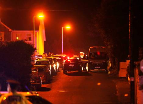 Gardai close off the road in Omeath Co Louth after the shooting