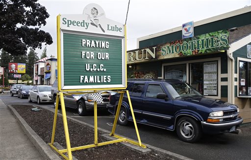 A sign in remembrance for those killed in a fatal shooting at Umpqua Community College is displayed at a local business Saturday Oct. 3 2015 in Roseburg Ore. Armed with multiple guns Chris Harper Mercer 26 walked in a classroom at the community