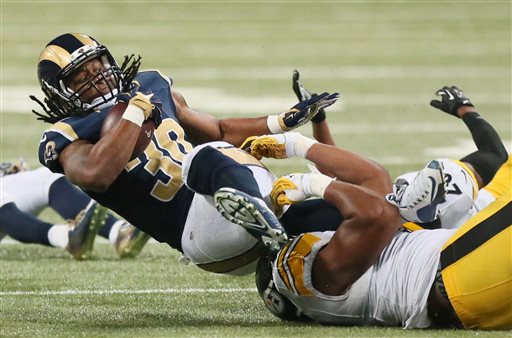 St. Louis Rams running back Todd Gurley is tackled by Pittsburgh Steelers defensive end Stephon Tuitt in the second quarter of an NFL football game on Sunday Sept. 27 2015 at the Edward Jones Dome in St. Louis. (Chris Lee  St. Louis Post Dispatch via A