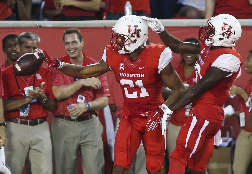 Demarcus Ayers dodges Tulane defenders during the first quarter of the NCAA college football game in New Orleans Friday Oct. 16 2015