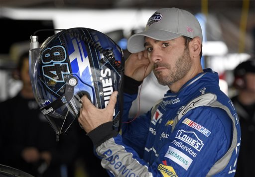 Jimmie Johnson gets ready before practice for the NASCAR Sprint Cup series auto race Saturday Oct. 3 2015 at Dover International Speedway in Dover Del