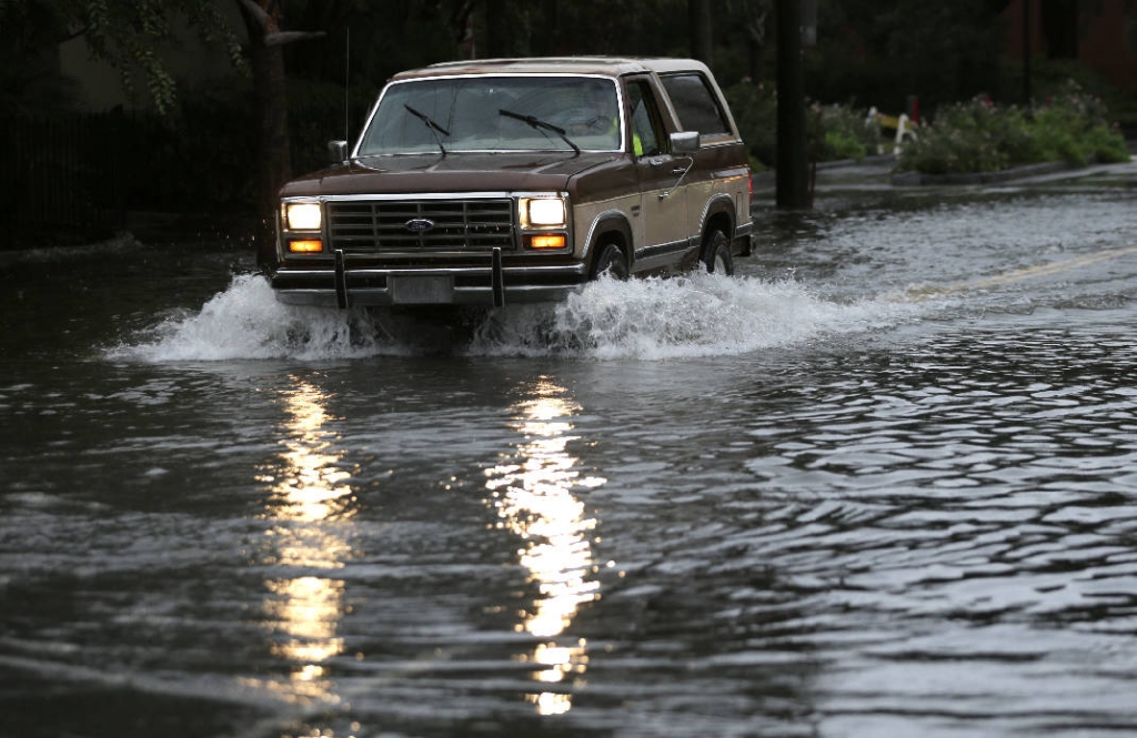 Streets submerged after heavy rain batters US south-east