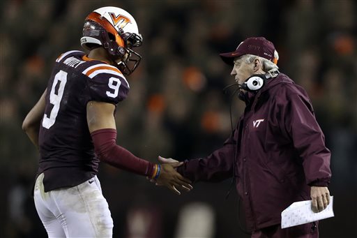 Virginia Tech quarterback Brenden Motley is congratulated by head coach Frank Beamer after his second touchdown pass against North Carolina State during the first half of an NCAA college football game Friday Oct. 9 2015 in Blacksburg Va. (Matt Ge