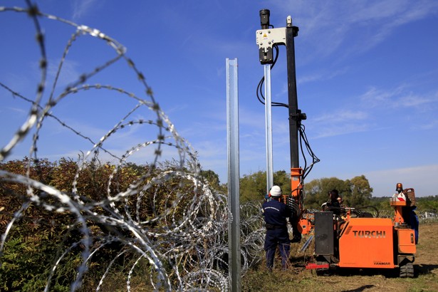 Hungarian army soldiers erect a fence on the border with Croatia near Zakany Hungary.         
                     Bernadett Szabo  Reuters