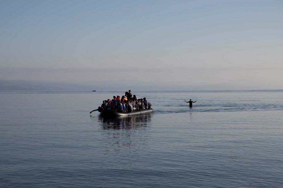 Afghan migrants arrive on the shores of the Greek island of Lesbos after crossing the Aegean sea from Turkey on a inflatable dinghy Sunday Sept. 27 2015. More than 260,000 asylum-seekers have arrived in Greece so far this year most reaching the country