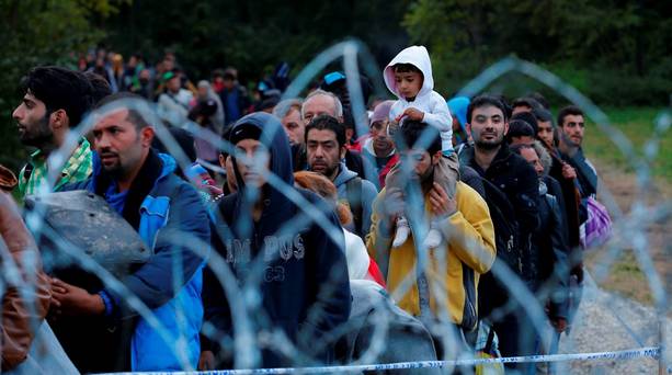 Migrants make their way after crossing the border at Zakany. Hungary said on Friday it would close its southern border with Croatia from midnight Credit Laszlo Balogh