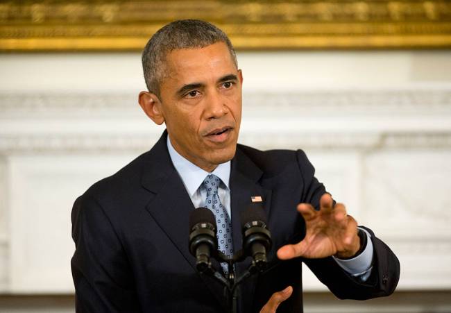 President Barack Obama gestures as he answers question from members of the media during a news conference in the State Dining Room of the White House in Washington Friday Oct. 2 2015