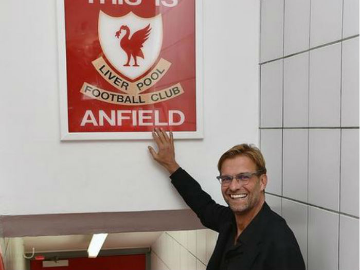 Jurgen Klopp touching the Liverpool sign'This is Anfield'on Thursday after being appointed as the Merseyside club manager