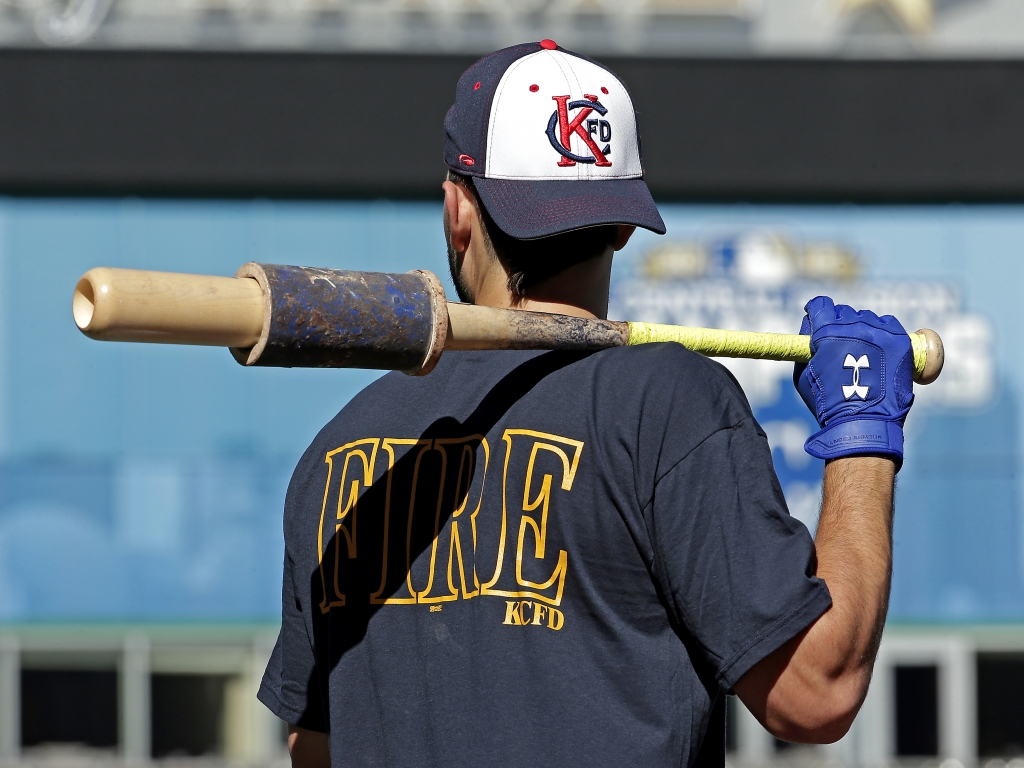 Kansas City Royals&#039 Eric Hosmer wears Kansas City Fire Department apparel as he waits to bat during baseball practice Tuesday Oct. 13 2015 in Kansas City Mo. The Royals face the Astros in Game 5 of the ALDS Wednesday. Hosmer was waring the shirt