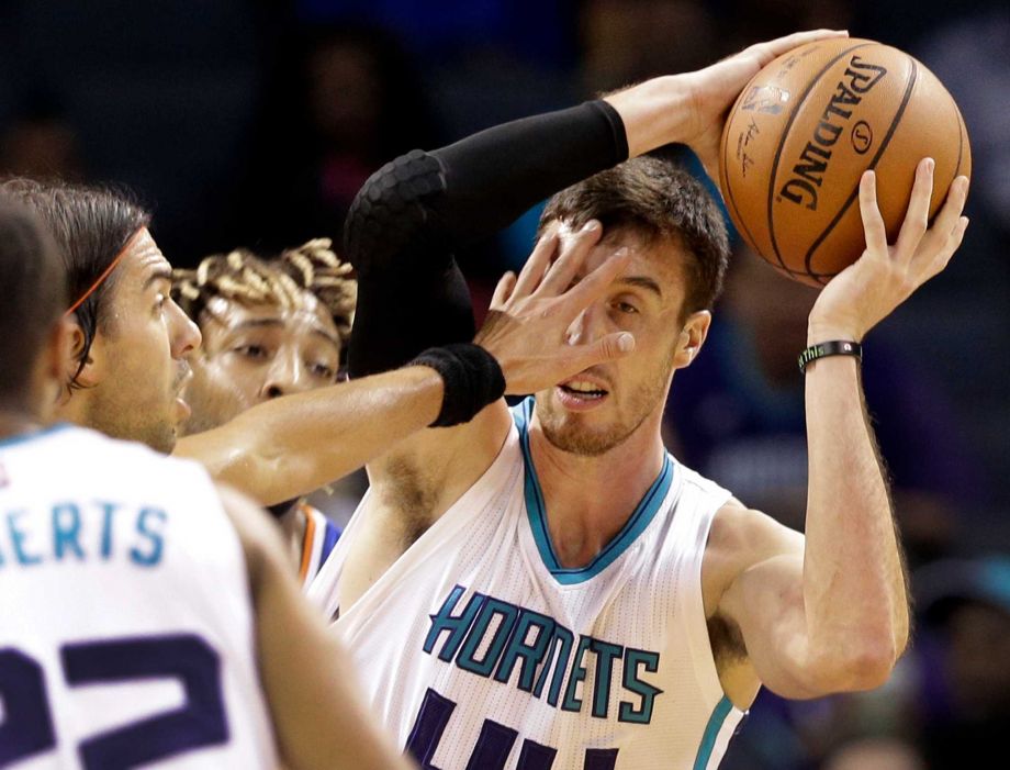 Charlotte Hornets Frank Kaminsky right looks to pass as New York Knicks Sasha Vujacic left defends in the first half of an NBA preseason basketball game in Charlotte N.C. Saturday Oct. 17 2015